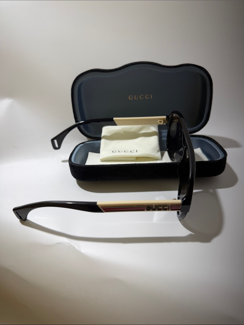 Gucci Men’s Black Sunglasses with Gold and Red Temple Accent